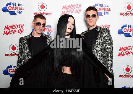 (left to right) Clean Bandit's Luke Patterson, Grace Chatto and Jack Patterson attending Capital's Monster Mash-Up with Vodafone at the Eventim Apollo in London. Stock Photo