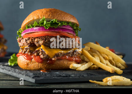 Homemade Cheese Smash Burger with Lettuce Tomato and Fries Stock Photo
