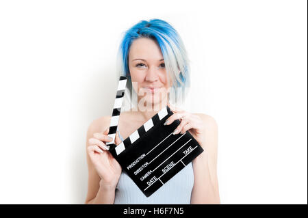 Teen alternative girl smiling and posing isolated on white background with movie clapper board for actress audition Stock Photo