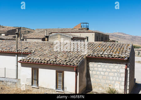 Ancient Sicilian rural architecture. Roofs with old clay tiles. All uninhabited houses. Old buildings. The places of Montalbano, Stock Photo