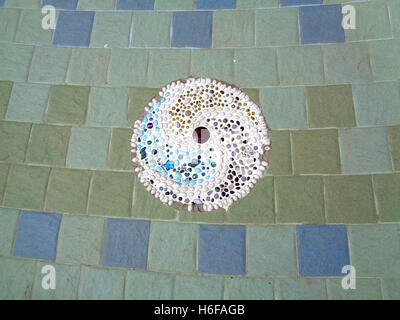 Blue and Green Tiled Floor with White Swirl Decoration in a Temple of Thailand Stock Photo