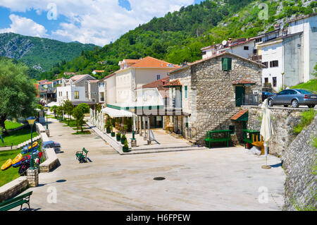 The town, located in valley of Crnojevica river, with many cozy cafes and hotels, surrounded by green mountains, Montenegro Stock Photo