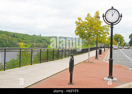 Round street clock on a pole Stock Photo