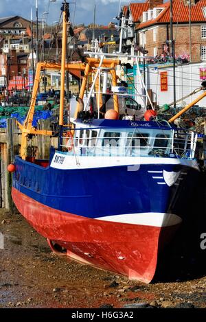 A fishing trawler at low tide in Scarborough Harbour.North Yorkshire,England UK Stock Photo