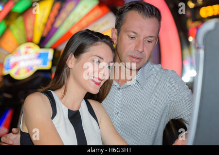 Middle aged couple in casino Stock Photo