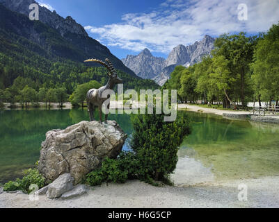 Lake Jasna and mountain goat statue in Kranjska Gora in Slovenia Stock Photo