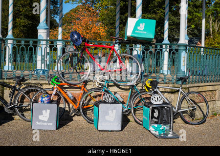 Deliveroo delivery bikes lined up in the Quarry, Shrewsbury, Shropshire, UK Stock Photo