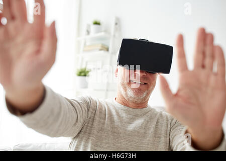old man in virtual reality headset or glasses Stock Photo