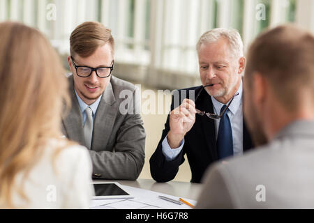 architects with tablet pc and blueprint at office Stock Photo