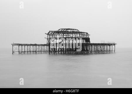 Black and white photograph of the remains of the west pier in Brighton Sussex United Kingdom Stock Photo