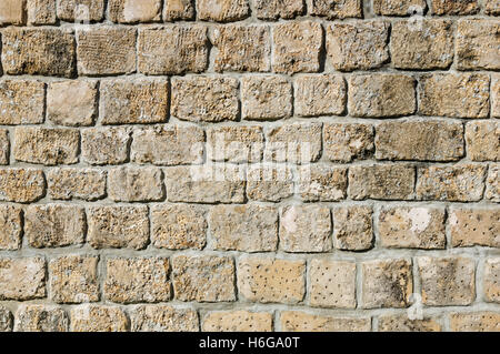 old dressed stone wall background texture Stock Photo