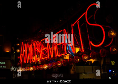 Red, neon amusements sign in London's Soho area. Stock Photo