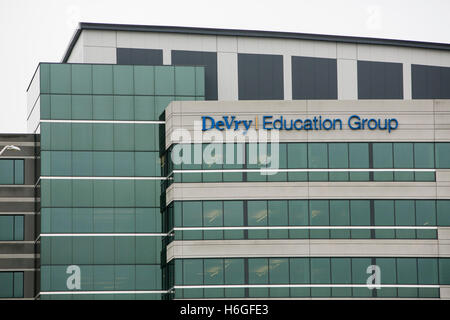 A logo sign outside of the headquarters of the DeVry Education Group in Downers Grove, Illinois on October 15, 2016. Stock Photo