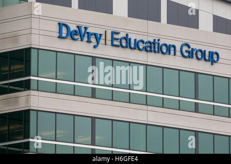 A logo sign outside of the headquarters of the DeVry Education Group in Downers Grove, Illinois on October 15, 2016. Stock Photo