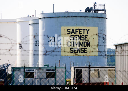 Petrol tankers with the message 'Safety Sense Common Sense' at an oil storage depot. Stock Photo