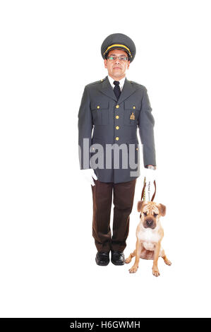 A security guard with his sharpei puppy dog standing in the studio in a dark olive green jacket and brown pants holding his dog Stock Photo