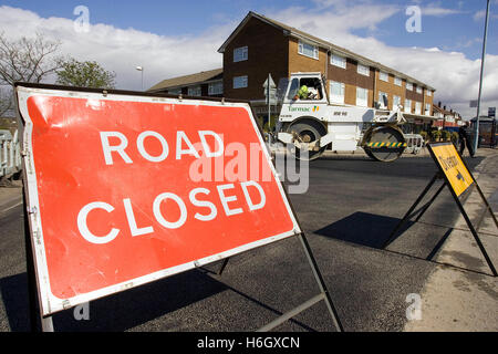 Road closed, diversion sign, road works, road roller Stock Photo