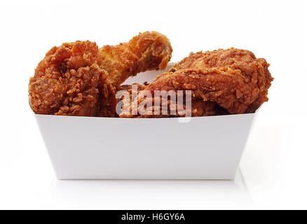 Fried breaded chicken in white cardboard box isolated on white background Stock Photo