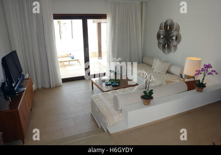 HERAKLION, CRETE, GREECE - MAY 13, 2014: Interior room with big bed, lamps and terrace in modern building of luxury class hotel. Stock Photo