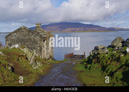 Old pier and building at Aird on the Craignish Peninsula, Argyll Stock Photo