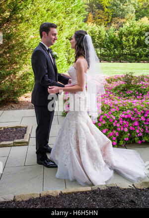 Groom & bride preparing for wedding photographs; Omni Bedford Springs Resort & Spa; Bedford; Pennsylvania; USA Stock Photo