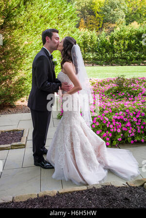 Groom & bride kiss for wedding photographs; Omni Bedford Springs Resort & Spa; Bedford; Pennsylvania; USA Stock Photo