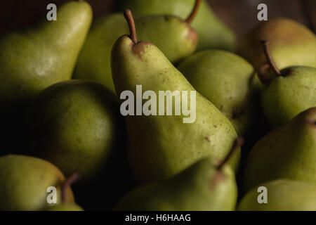 Still life of ripe Bartlett pears in subdued lighting Stock Photo