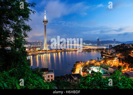 The Macau Tower with the view of the Sai Van Bridge during twilight. Stock Photo