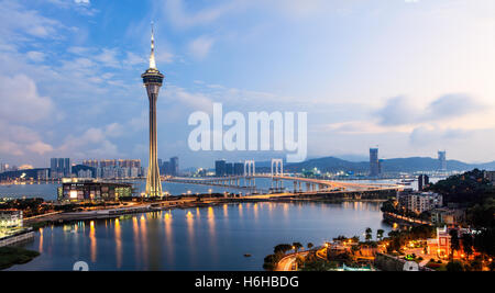 The Macau Tower with the view of the Sai Van Bridge during twilight. Stock Photo