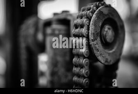 Rusty old chain on farm equipment Stock Photo
