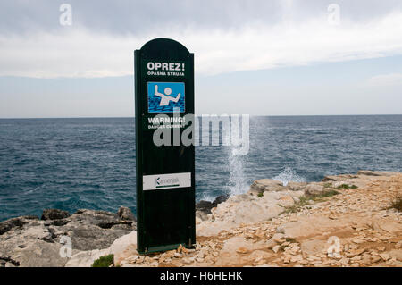 Warning sign on the coast, Cape Kamenjak protected landscape, Istria, Croatia, Europe Stock Photo