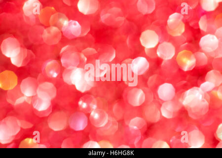 Red  blurred background with light spots. Defocused sparkles texture Stock Photo