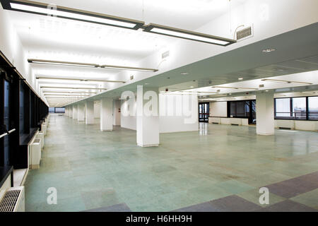 Bright and empty business offices with long hall and a view overlooking the city Stock Photo