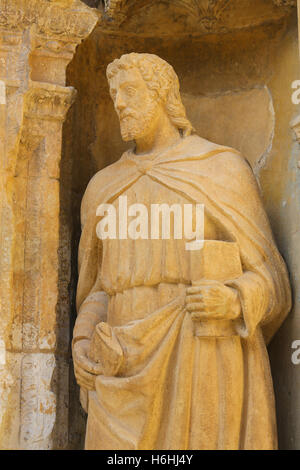 Statue of the Apostle Saint Matthias, depicted with an axe, in the 16th Century Principal Gate at the Church of Santo Tomas in H Stock Photo