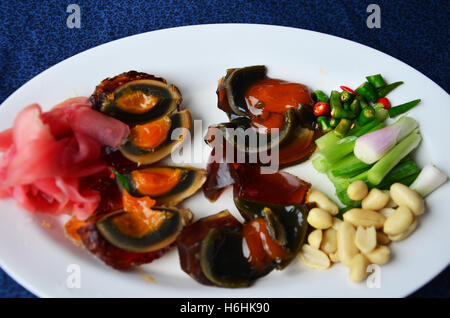 Appetizer century egg or pidan also known as preserved egg, hundred-year egg, thousand-year egg, thousand-year-old egg, and mill Stock Photo