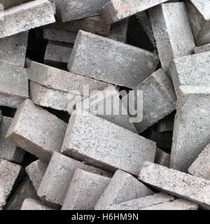 Heap of grey bricks. Stock Photo