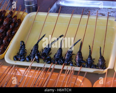 Black scorpion snacks sold in a food stall in a food market in Beijing, China Stock Photo