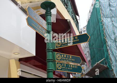 Street signs in chinese, english and portuguese on the streets of Macau, china