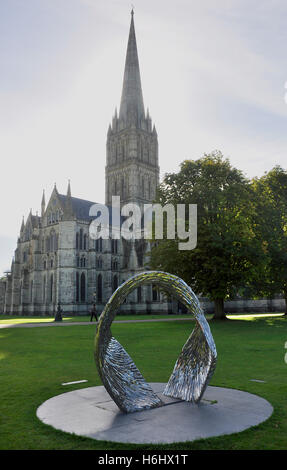 Salisbury Cathedral - view against the light - sculpture in foreground - sunlight and shadows - atmospheric Stock Photo