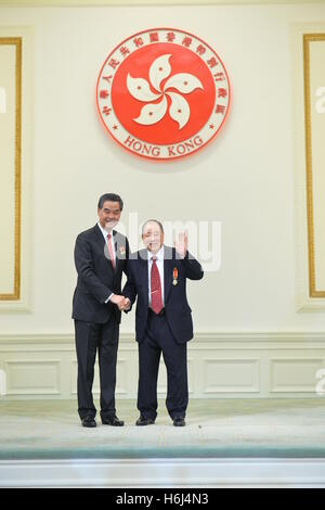 Hong Kong. 29th Oct, 2016. Leung Chun-ying (L), chief executive of the Hong Kong Special Administrative Region (SAR), confers the Grand Bauhinia Medal to Hu Fa-kuang, Honorary Chairman of Ryoden Development Limited, at the 2016 Honors and Awards Presentation Ceremony in Hong Kong, south China, Oct. 29, 2016. © Xinhua/Alamy Live News Stock Photo