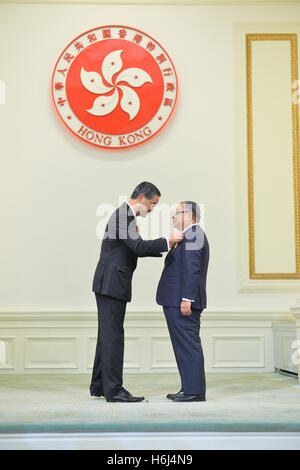 Hong Kong. 29th Oct, 2016. Leung Chun-ying (L), chief executive of the Hong Kong Special Administrative Region (SAR), confers the Grand Bauhinia Medal to Chan Wing-kee, permanent honorary president of Friends of Hong Kong Association and president of the Federation of Hong Kong Community Organizations, at the 2016 Honors and Awards Presentation Ceremony in Hong Kong, south China, Oct. 29, 2016. © Xinhua/Alamy Live News Stock Photo