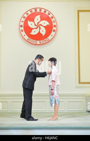 Hong Kong. 29th Oct, 2016. Leung Chun-ying (L), chief executive of the Hong Kong Special Administrative Region (SAR), confers the Grand Bauhinia Medal to Lam Cheng Yuet-ngor, Chief Secretary for Administration of Hong Kong, at the 2016 Honors and Awards Presentation Ceremony in Hong Kong, south China, Oct. 29, 2016. © Xinhua/Alamy Live News Stock Photo