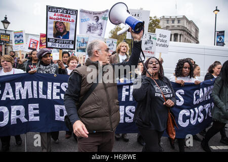 London, UK. 29th October, 2016. Janet Alder, sister of Christopher Alder, addresses campaigners from the United Families and Friends Campaign (UFFC) during the annual procession to Downing Street in remembrance of family members and friends who died in police custody, prison, immigration detention or secure psychiatric hospitals. Christopher Alder, 37, died handcuffed and face down surrounded by police officers in a Hull police station in April 1998 after choking on his own vomit. Credit:  Mark Kerrison/Alamy Live News Stock Photo
