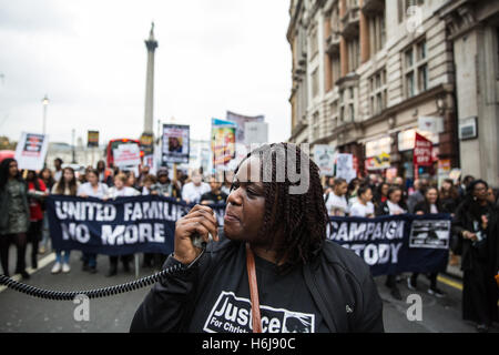 London, UK. 29th October, 2016. Janet Alder, sister of Christopher Alder, addresses campaigners from the United Families and Friends Campaign (UFFC) during their annual procession to Downing Street in remembrance of family members and friends who died in police custody, prison, immigration detention or secure psychiatric hospitals. Christopher Alder, 37, died handcuffed and face down surrounded by police officers in a Hull police station in April 1998 after choking on his own vomit. Credit:  Mark Kerrison/Alamy Live News Stock Photo