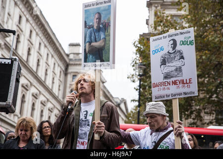 London, UK. 29th October, 2016. The brother of Darren Neville addresses campaigners from the United Families and Friends Campaign (UFFC) outside Downing Street following their annual procession in remembrance of family members and friends who died in police custody, prison, immigration detention or secure psychiatric hospitals. Darren Neville, 28, died at the Whittington Hospital on 5th May 2013, nearly two months after suffering a cardiac arrest while being restrained by police. Credit:  Mark Kerrison/Alamy Live News Stock Photo