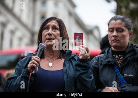 London, UK. 29th October, 2016. Karin Revell, mother of Greg Revell, addresses campaigners from the United Families and Friends Campaign (UFFC) outside Downing Street following their annual procession. Greg Revell, 18, was found hanged in his cell on 11th June 2014 during his second night in custody at HMP Glen Parva in Leicestershire. Credit:  Mark Kerrison/Alamy Live News Stock Photo
