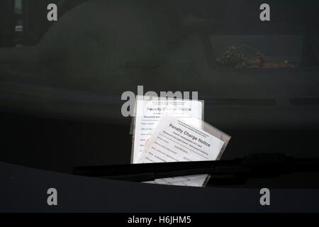 Two parking tickets are attached to the windscreen of a car in London, Britain October 30, 2016. © John Voos Stock Photo