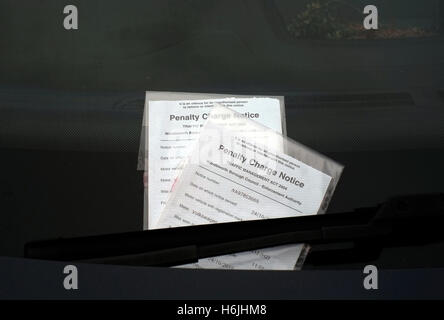Two parking tickets are attached to the windscreen of a car in London, Britain October 30, 2016. © John Voos Stock Photo