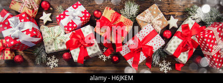 Christmas gift boxes placed on wooden planks in panoramatic composition Stock Photo