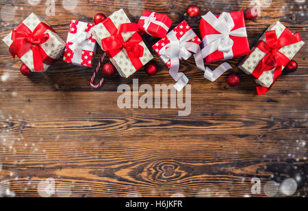 Christmas gift boxes placed on wooden planks. Copyspace for text Stock Photo